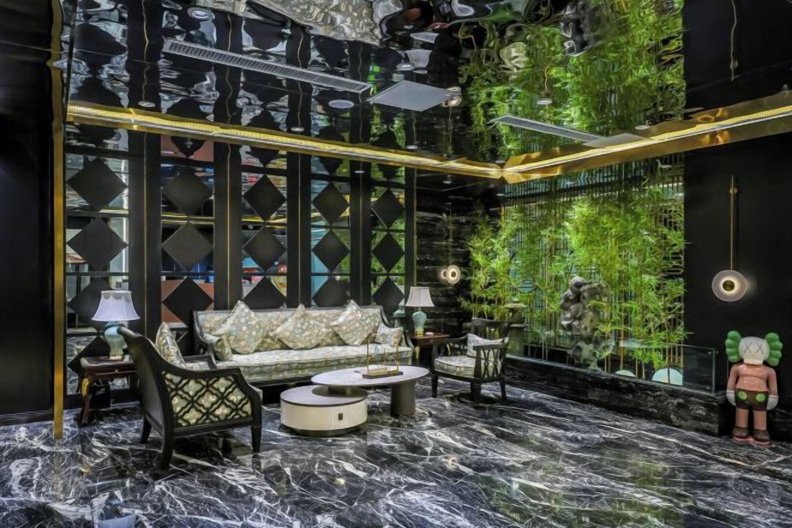 A modern interior with a sofa, coffee table, and decorative items.