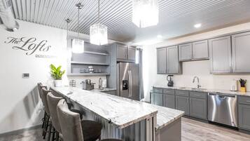 Microwave, dishwasher, coffee/tea maker, cookware/dishes/utensils