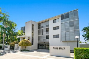 A modern building with a sign reading "AQUA LINEA." - Unit 04 Aqua Linea (Noosa Heads)