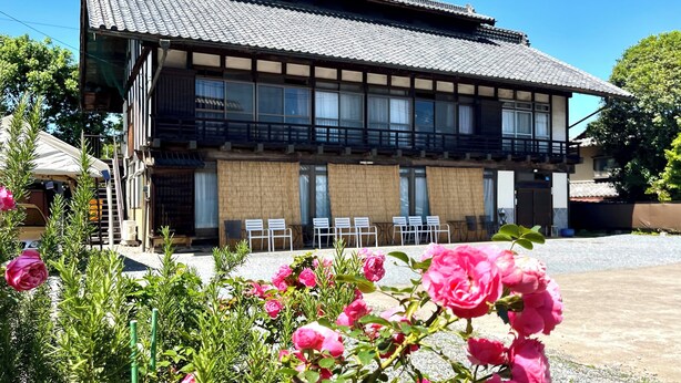 A traditional Japanese building with a tiled roof, wooden beams, and a balcony. - Kiyomizu House (Takasaki)