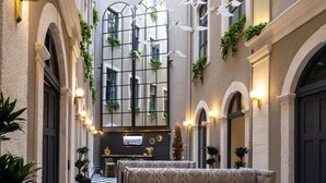 A hotel lobby with a checkered floor, patterned sofas, and a central seating area. - Ferman Port Hotel - Special Class (Istanbul)