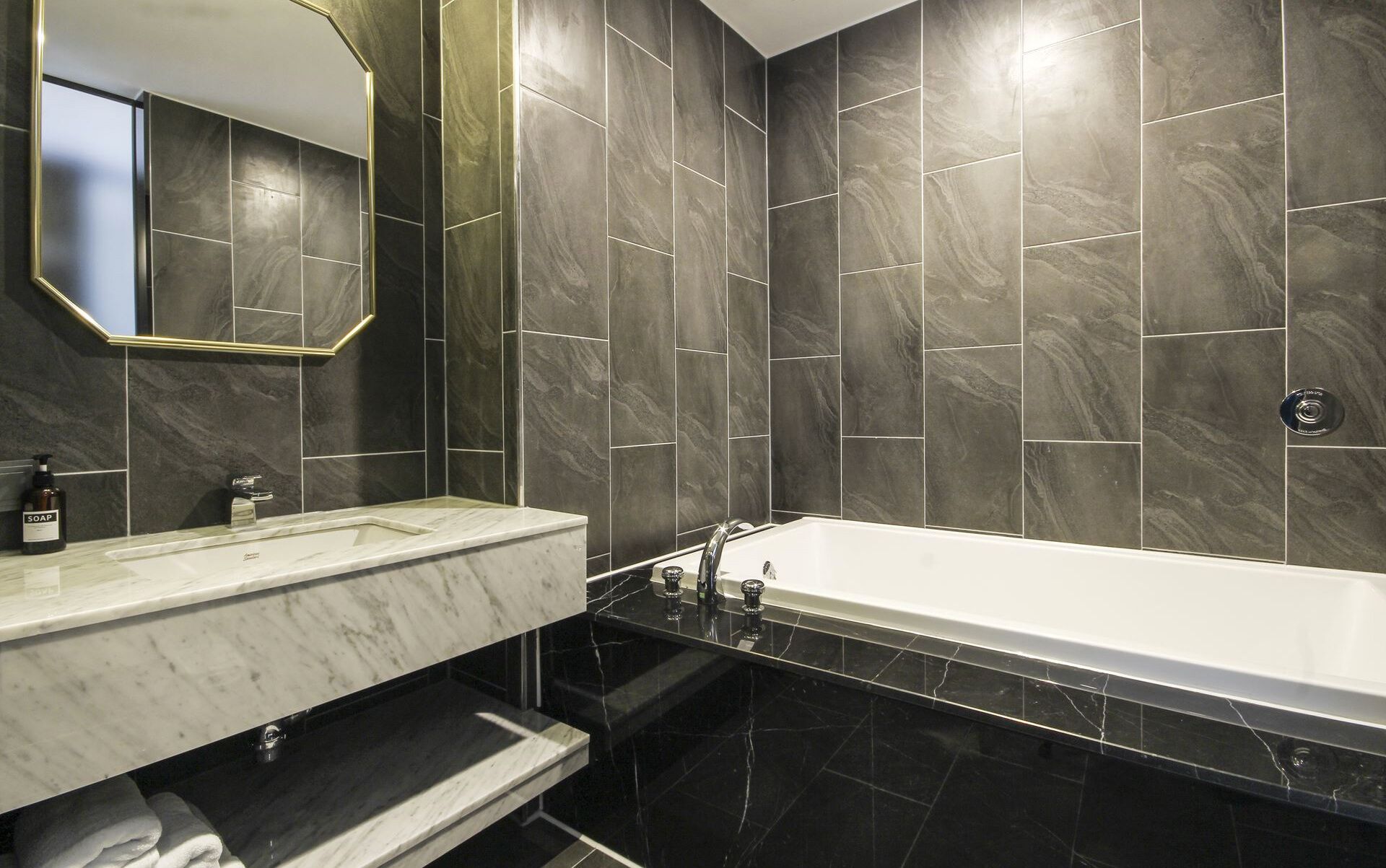 separate bathtub and shower, deep-soaking bathtub, designer toiletries