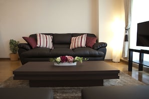 Luxury Family Room (H01) | Living room | 32-inch flat-screen TV with digital channels, TV - Nipponbashi-House II-A (Osaka)