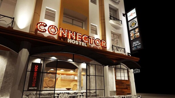 A hotel named "CONNECTOR HOSTEL" with a prominent illuminated sign. - Connector Hostel (Makati)
