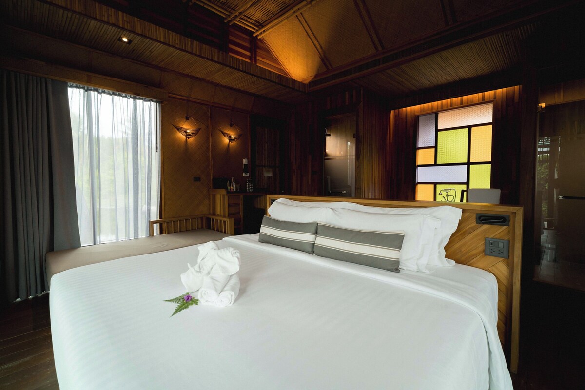 Premium Corner Overwater Villa | Minibar, in-room safe, desk, laptop workspace