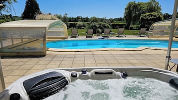 Indoor pool, seasonal outdoor pool, pool umbrellas, pool loungers