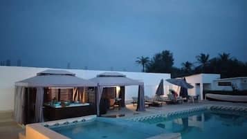 Seasonal outdoor pool, pool umbrellas, pool loungers