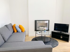 Apartamento, 1 quarto (Apt 1) | Área de estar | TV de tela plana
