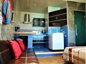 Classic Studio | Living area | 42-inch flat-screen TV with cable channels, TV - Kaeli's Caribbean Studios (Campeche)