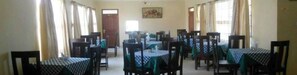 A dining area with multiple tables and chairs, arranged in rows. - Jirime Hotel & Resort (Marsabit)