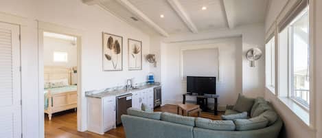 Flat-screen TV, DVD player, books