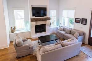 Flat-screen TV, DVD player, books