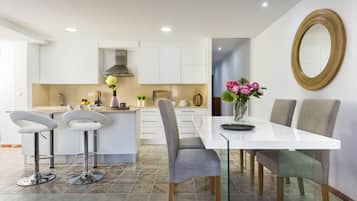 Apartment, 4 Bedrooms | Private kitchen | Full-size fridge, microwave, oven, stovetop