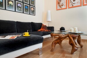 Apartment, 2 Bedrooms | Living room | 32-inch flat-screen TV with cable channels, TV