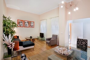 Apartment, 2 Bedrooms | Living room | 32-inch flat-screen TV with cable channels, TV