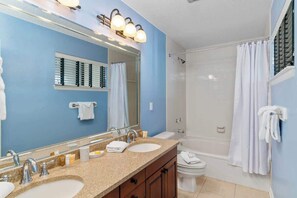 Shower, hair dryer, towels, shampoo