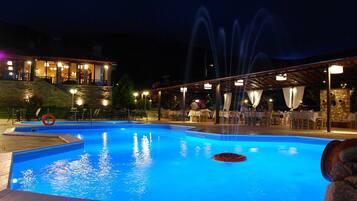Seasonal outdoor pool, open 10:00 AM to 8:00 PM, pool umbrellas