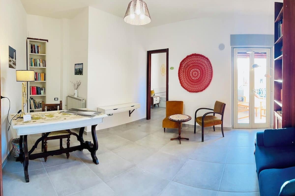 Family Room, 2 Bedrooms, Partial Sea View (Mandala) | Living area | TV, books