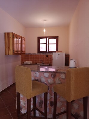 Fridge, oven, electric kettle, cookware/dishes/utensils