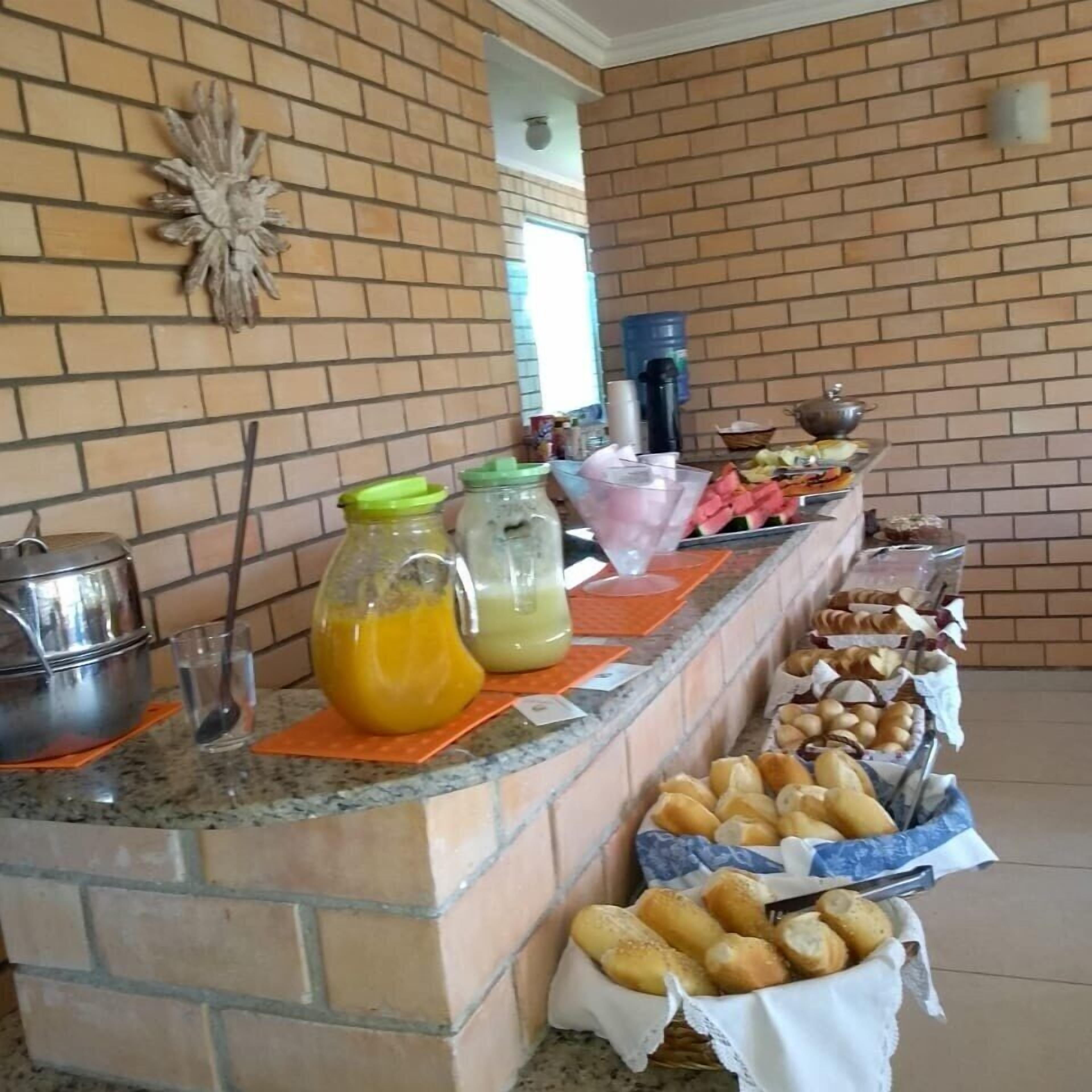 A breakfast buffet with various food items and beverages.