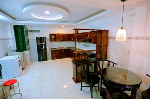 Full-sized fridge, rice cooker, cookware/dishes/utensils