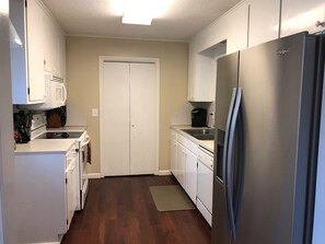 Microwave, dishwasher, coffee/tea maker, cookware/dishes/utensils