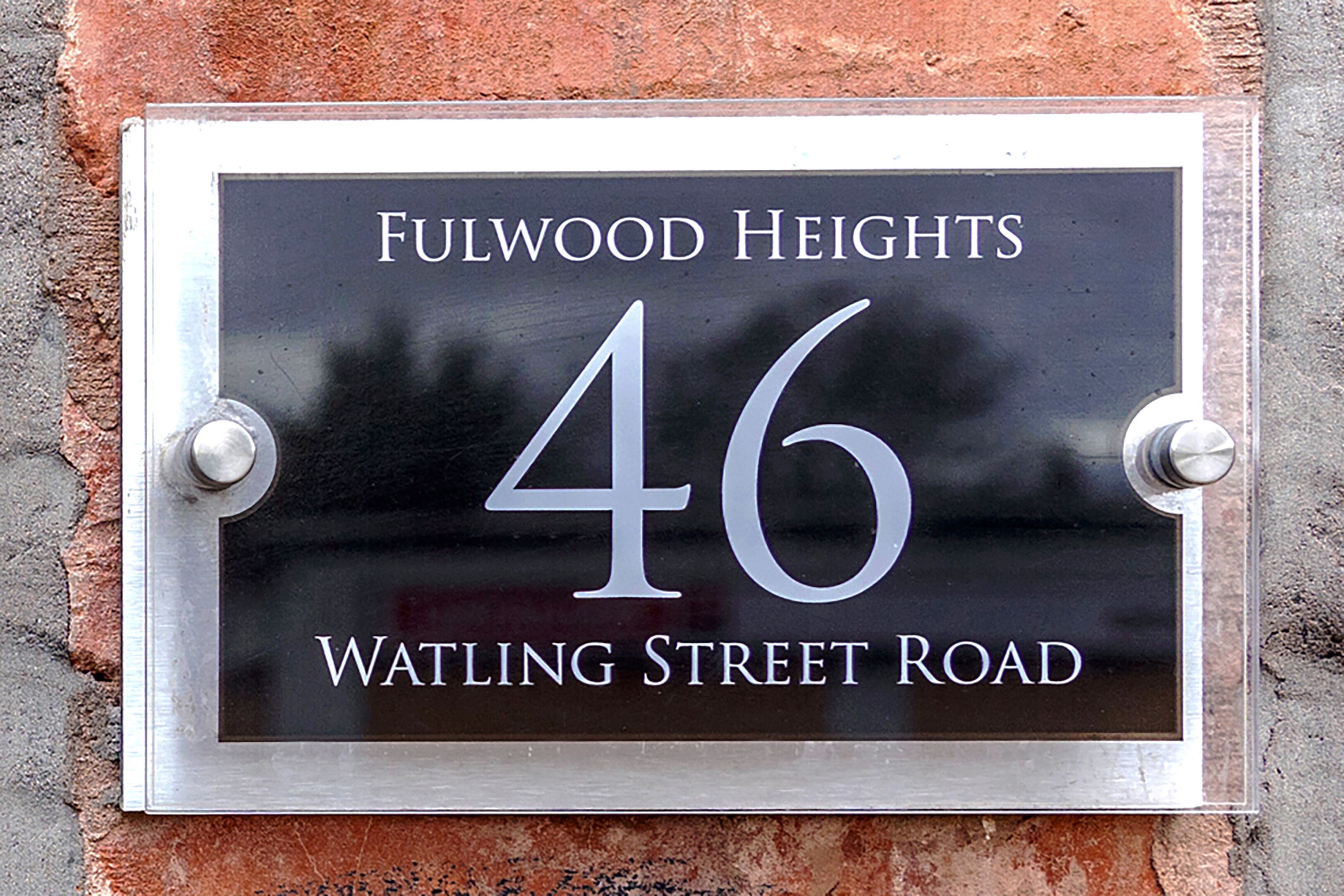 A house number sign for Fulwood Heights, 46 Watling Street Road.