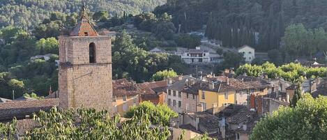 A historic town with a prominent tower and traditional buildings.