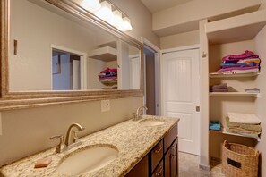 Combined shower/bathtub, hair dryer, towels, soap