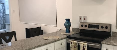 Fridge, microwave, stovetop, coffee/tea maker