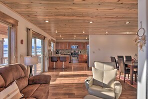 Relax in this stylish living area with a sofa, armchair, and dining table, perfect for socializing.