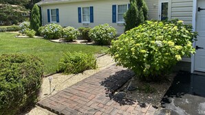 A single-story house with a brick pathway leading to the front door. - Quiet neighborhood/ pets friendly? fenced in / close to beach (Rehoboth Beach)