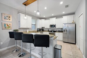 Fridge, microwave, oven, stovetop - Villa 9020 - Near Parks, Free Pool/Spa Heat, Game Rm, & PS5! UPDATED MAY 2026! (Champions Gate)
