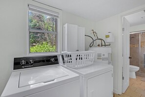 Coming back dowstairs. Directly across from the staircase is the laundry room with washer and dryer. - Mi Rancho- 2 bed/2 bath-Hot tub, Fire pit, and Pinball machine! (Wimberley)