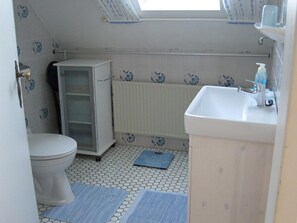 Shower, hair dryer, towels, toilet paper