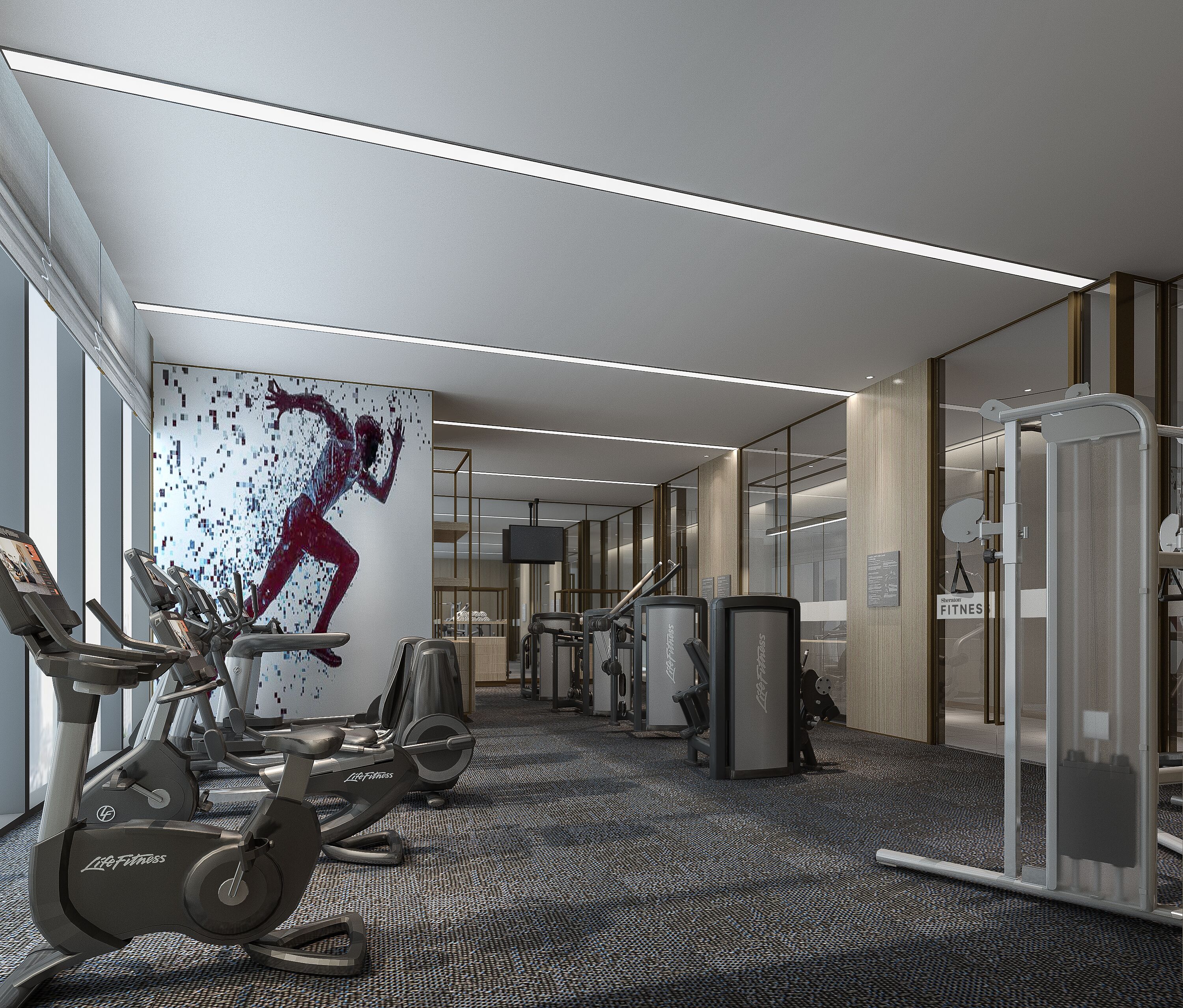 A modern gym with exercise equipment, a large digital screen, and a motivational artwork on the wall.