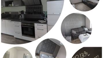 Eine moderne Küche mit Einbauofen, ein Essbereich mit einer Couch, ein Badezimmer mit Glasdusche und ein Schlafzimmer mit Bett und Nachttisch.