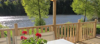 Comfortable mobile home with terrace on the edge of fishing ponds; small boat.