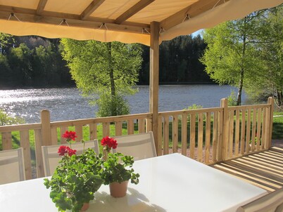 Comfortable mobile home with terrace on the edge of fishing ponds; small boat.