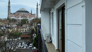A balcony with a view of a historic building with a dome and minarets. - Basilica GuestHouse (Istanbul)