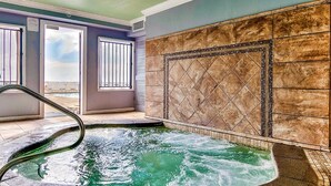 A spa area with a hot tub, a view of the beach, and a tiled wall. - Seas The Day Regency Towers 1122-Beachfront-Beautiful Decor. Fantastic Views! (Panama City)