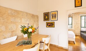 Deluxe Apartment, 1 Bedroom | Living area | 50-inch Smart TV with digital channels, TV, Netflix
