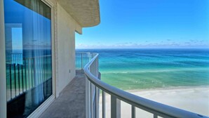 A balcony with a view of the ocean and a sandy beach. - Shores of Panama 1529-End Unit~Sleeps 8 (Panama City Beach)