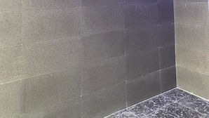 A wall with the words "POSH" and the tagline "...feel at home" in a modern font. - Posh Hotel And Suites (Lagos)