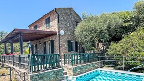 A stone building with a pool featuring a checkered pattern. - Beautiful private villa with WIFI, private pool, TV, terrace, pets allowed and panoramic view (Pietrabruna)