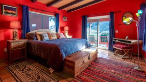 A bedroom with a bed, a desk, a chair, a dresser, and a window with curtains. - Chucks cabin Joshua Tree region, your desert Oasis (TWENTYNIN PLAMs)