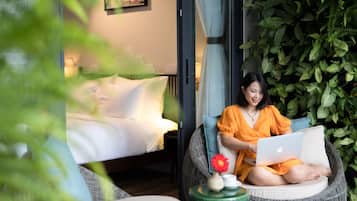 King Suite, Pool View | Minibar, desk, laptop workspace, blackout drapes