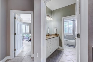 Queen bedroom upstairs with a full size guest bathroom nearby.