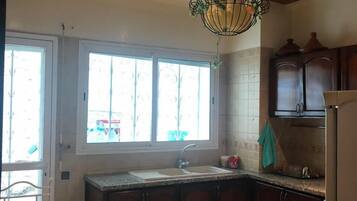 Apartment, 3 Bedrooms | Private kitchen | Full-size fridge, stovetop, espresso maker, cookware/dishes/utensils