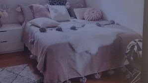A bedroom with a bed, bedside tables, a rug, and wall decorations. - welcome our elegant, luxurious and unique properties where our visitor receive all services 24 hours. Our homes are located in a cool environment where your enjoy a beautiful serenity. Our homes jave easy access to social amenities, public service, eas... (Juja)